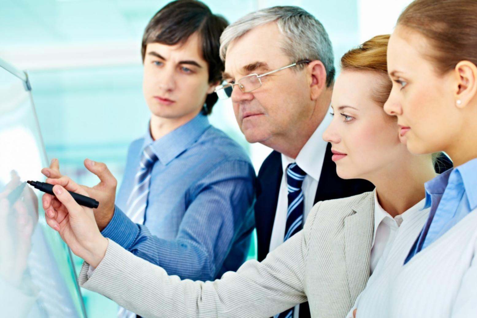 Professional team reviewing financial documents and cost management strategies in modern office environment